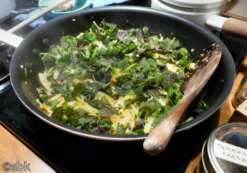 Nettles sautéing with onions and spices
